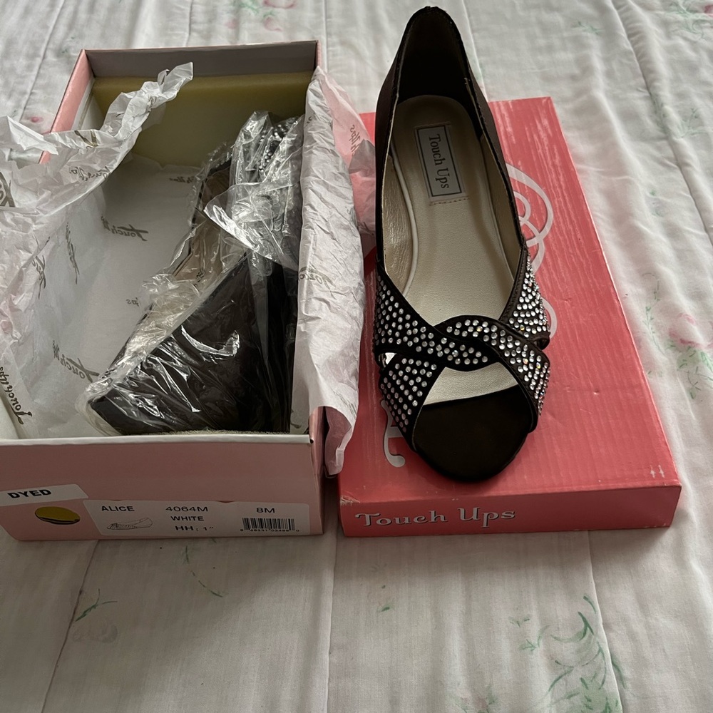 Brand new in original box never worn. Rhinestone shoes